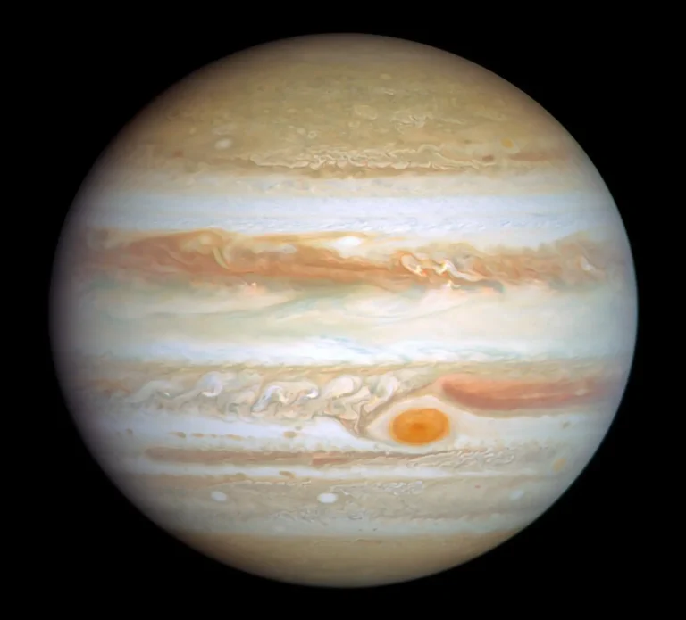 Jupiter with swirling clouds and the Great Red Spot visible.
