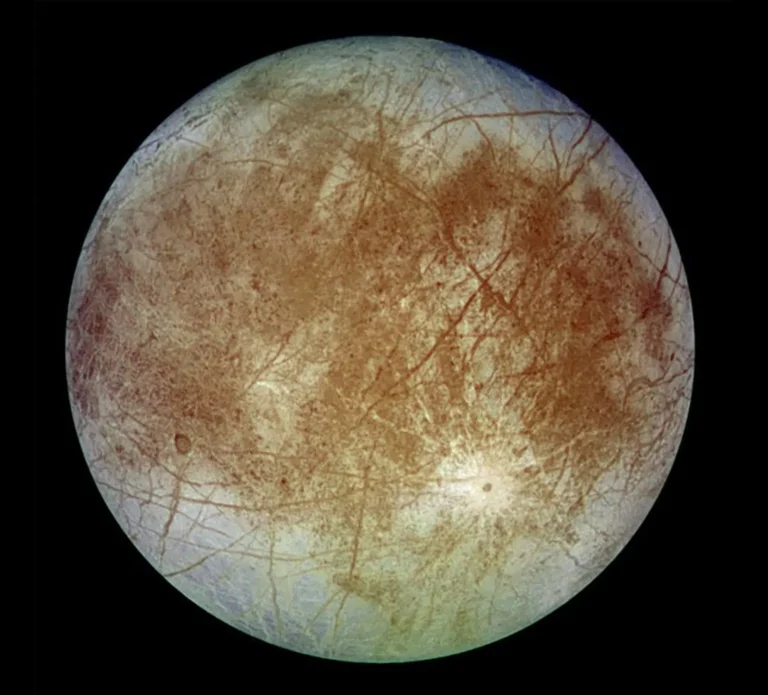 Europa, one of the moons of Jupiter, with a cracked icy surface possibly hiding a subsurface ocean.